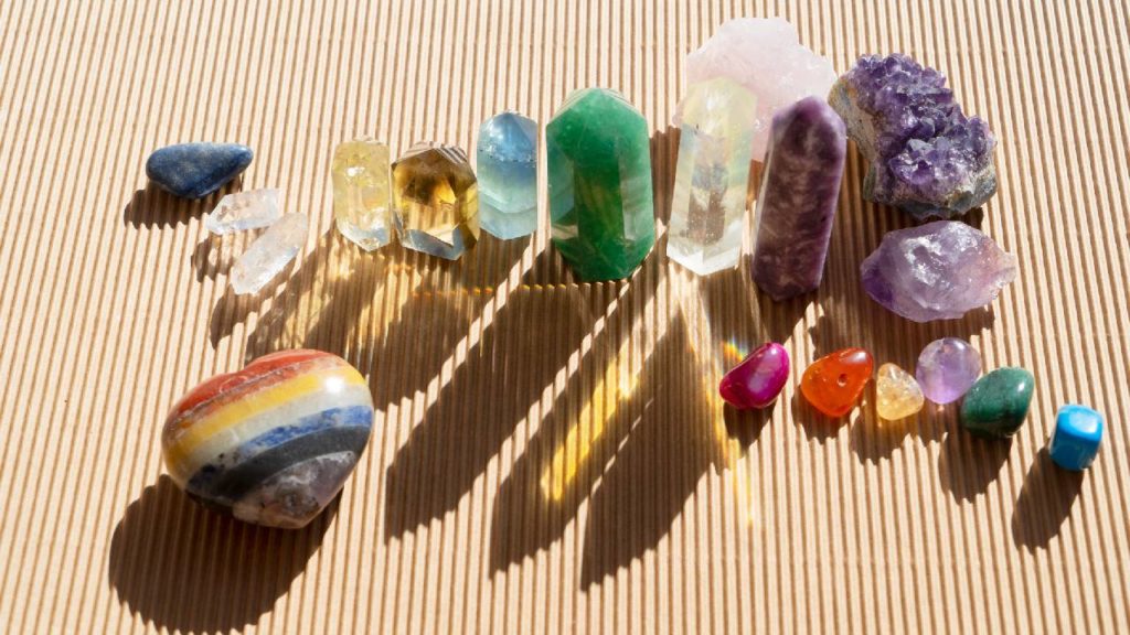 Colorful healing crystals for fear of death on brown background