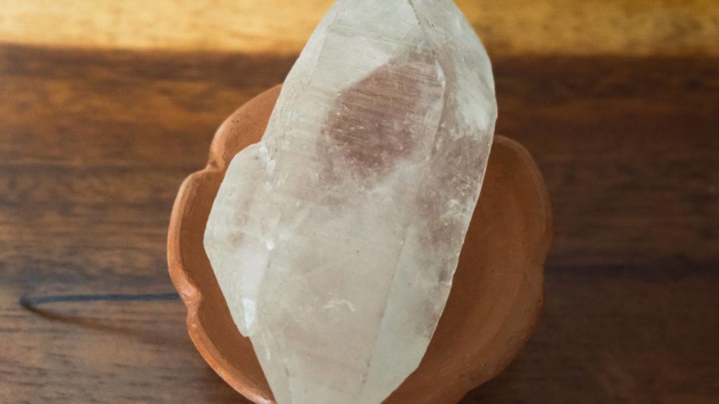 Large clear quartz on clay support