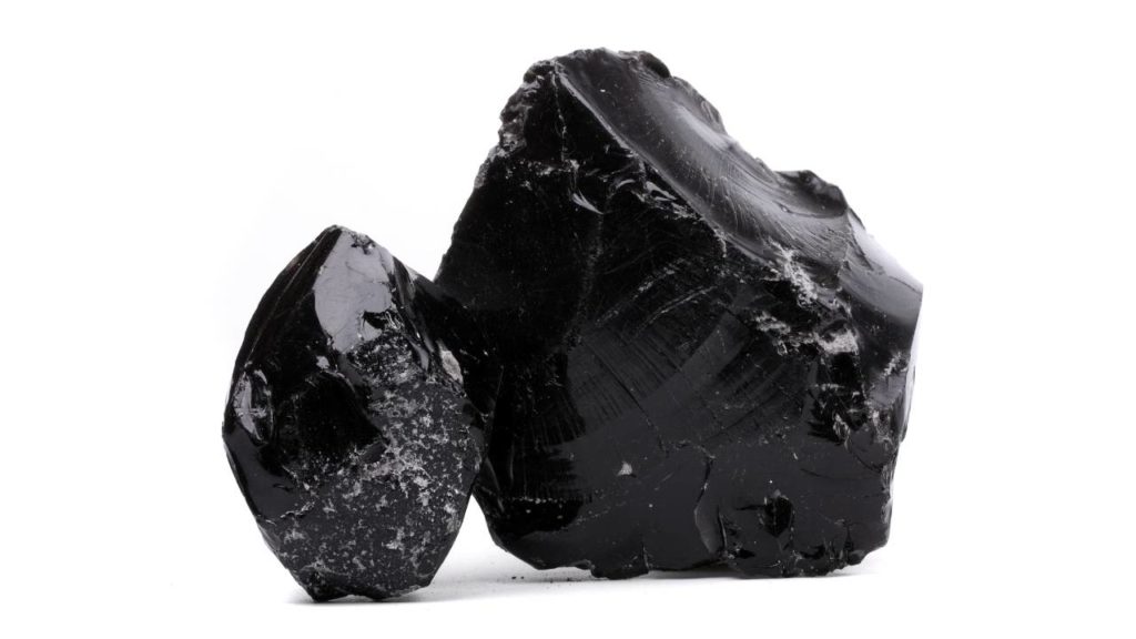 Two rough obsidian stones