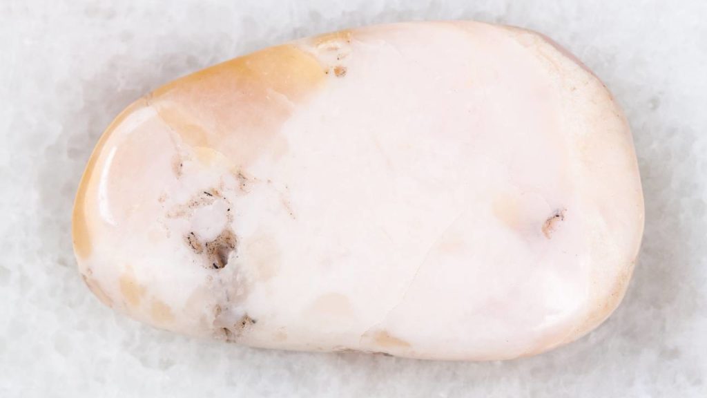 Close up of polished pink opal stone
