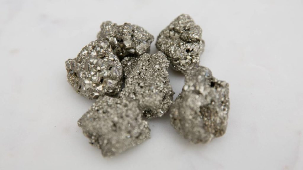 Pyrite minerals on a white background