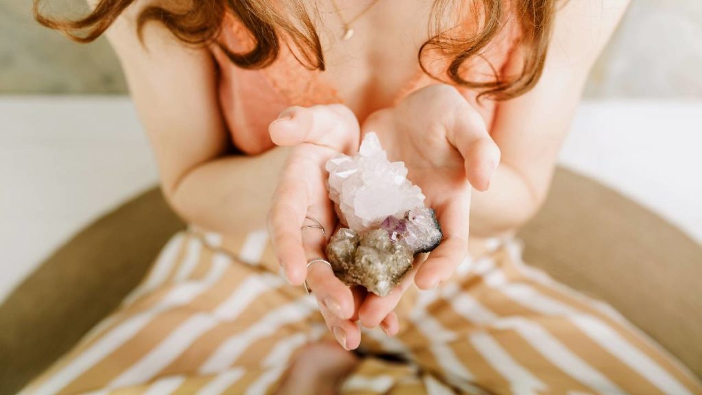 Woman holding healing crystals